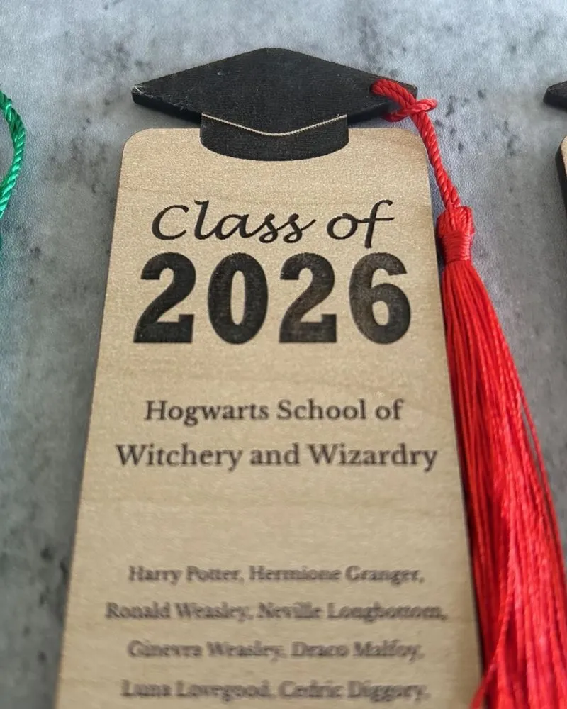 Close-up of precision laser-cut detail on a graduation keepsake bookmark